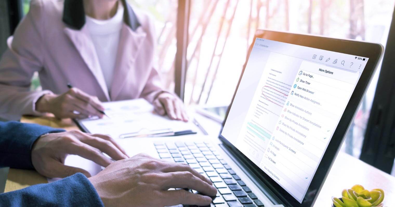 man and woman writing a nonprofit business plan
