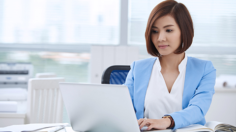Woman attending a virtual AGM